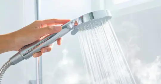 Hot water flowing from shower head